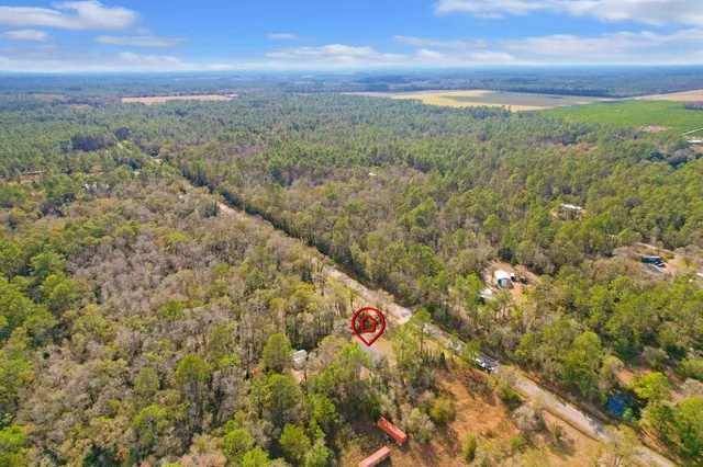a view of a field with an outdoor space