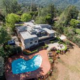 an aerial view of a house with outdoor space