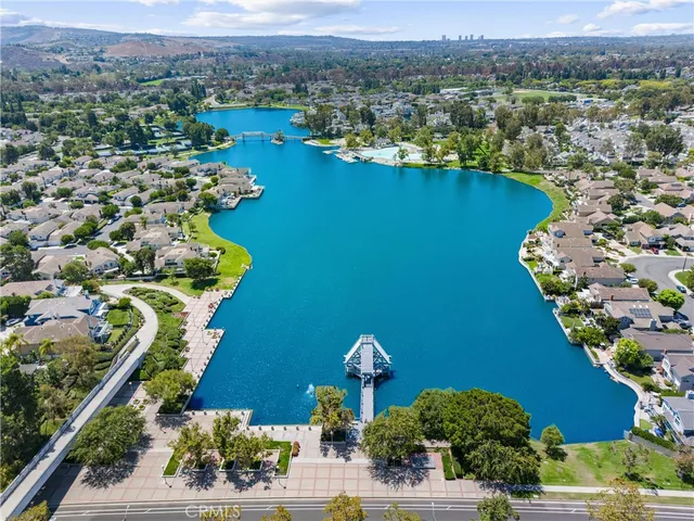 an aerial view of a house with a lake view