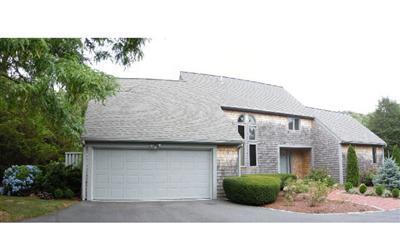 208 Huckins Neck Road Centerville, MA 02601 - Photo 1 of 12 a front view of a house with a garden