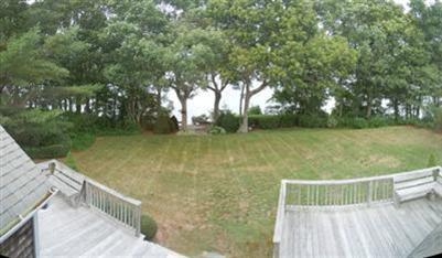 208 Huckins Neck Road Centerville, MA 02601 - Photo 6 of 12 a view of a balcony with yard