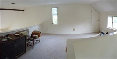 208 Huckins Neck Road Centerville, MA 02601 - Photo 8 of 12 wooden floor and windows in a room