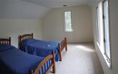 208 Huckins Neck Road Centerville, MA 02601 - Photo 9 of 12 a view of a hallway with furniture and window
