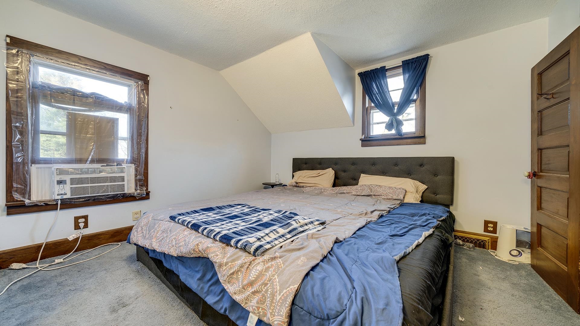 4738 Owen Center Road Rockford, IL 61101 - Photo 11 of 42 a bedroom with a bed and wooden floor