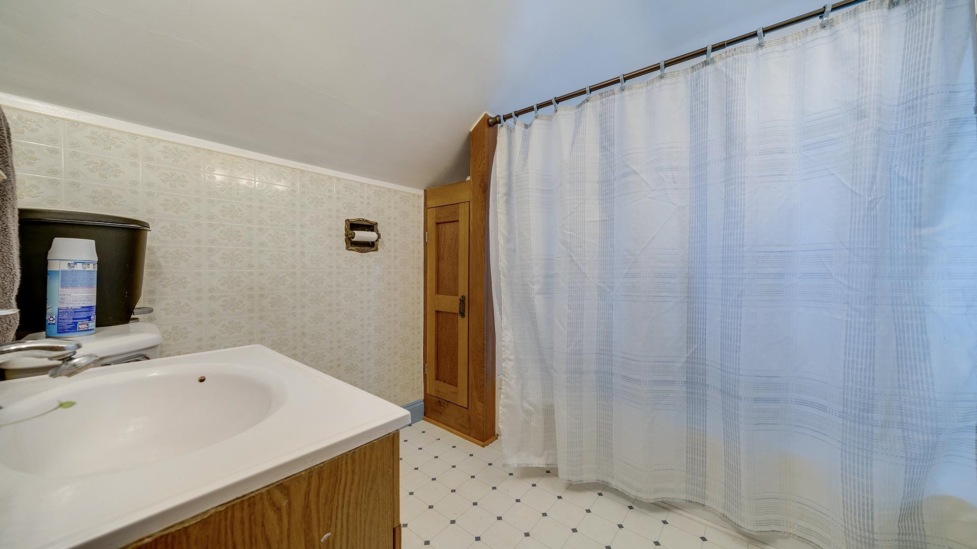 4738 Owen Center Road Rockford, IL 61101 - Photo 14 of 42 a bathroom with a sink and a mirror