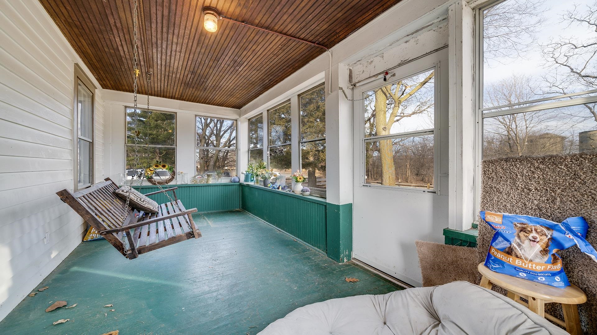 4738 Owen Center Road Rockford, IL 61101 - Photo 18 of 42 a living room with patio furniture and a floor to ceiling window