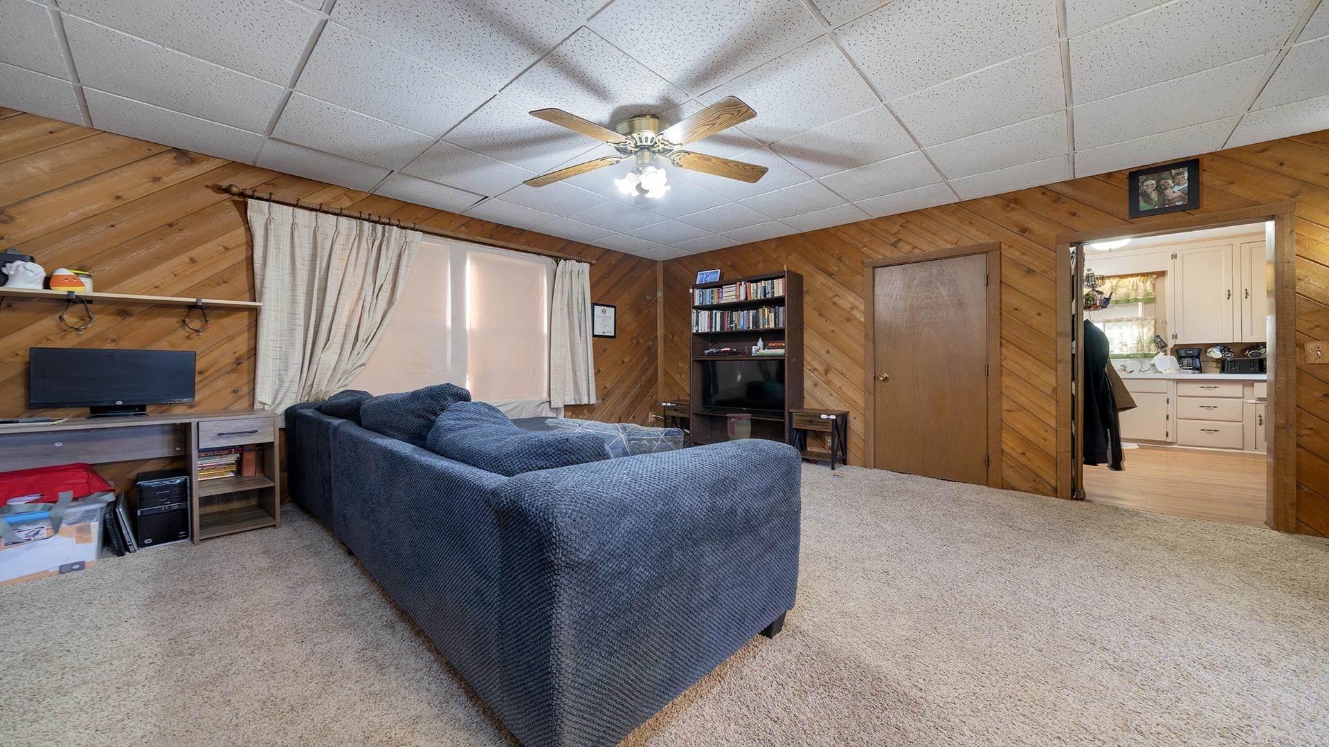 4738 Owen Center Road Rockford, IL 61101 - Photo 5 of 42 a living room with furniture and a flat screen tv