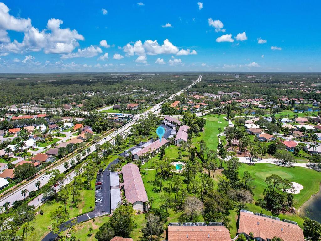 5825 Rattlesnake Hammock Road, Unit 202 Naples, FL 34113 - Photo 1 of 30 a view of a city with lots of green space