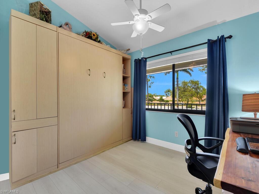 5825 Rattlesnake Hammock Road, Unit 202 Naples, FL 34113 - Photo 14 of 30 a view of a workspace with furniture and a window