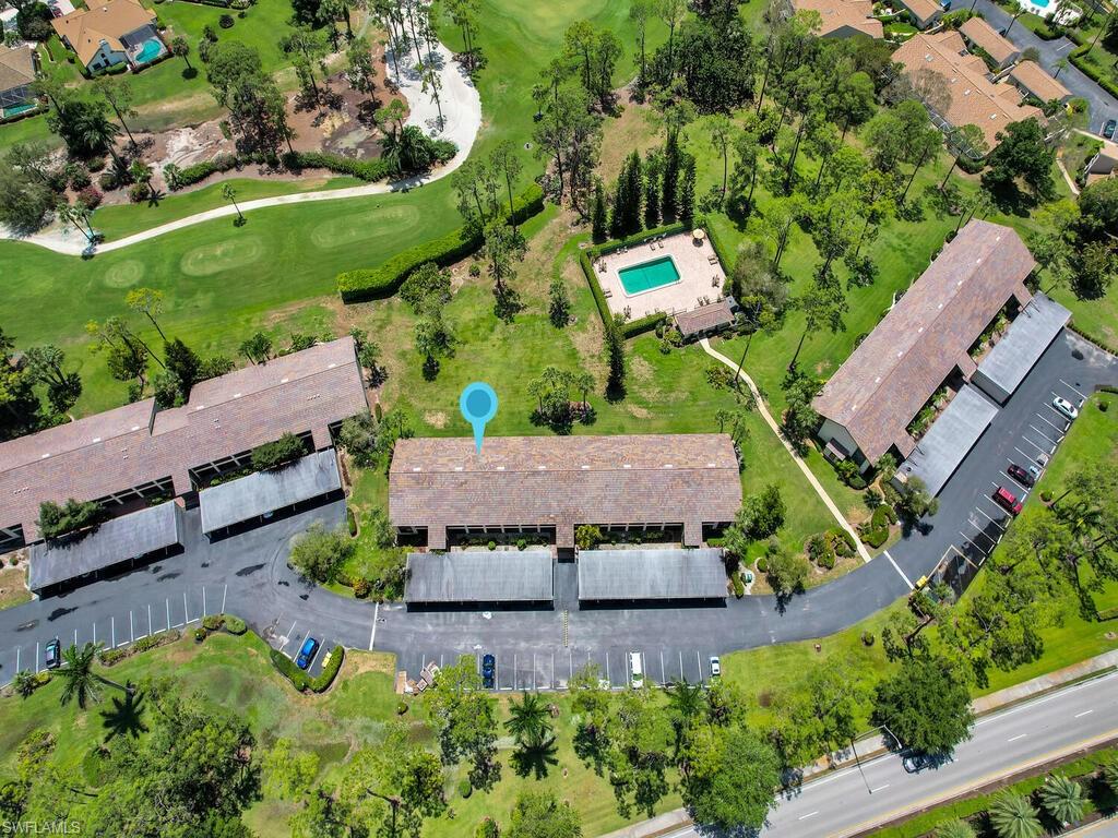 5825 Rattlesnake Hammock Road, Unit 202 Naples, FL 34113 - Photo 2 of 30 an aerial view of a house with a garden