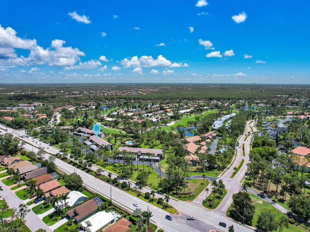 5825 Rattlesnake Hammock Road, Unit 202 Naples, FL 34113 - Photo 28 of 30 an aerial view of residential building with outdoor space