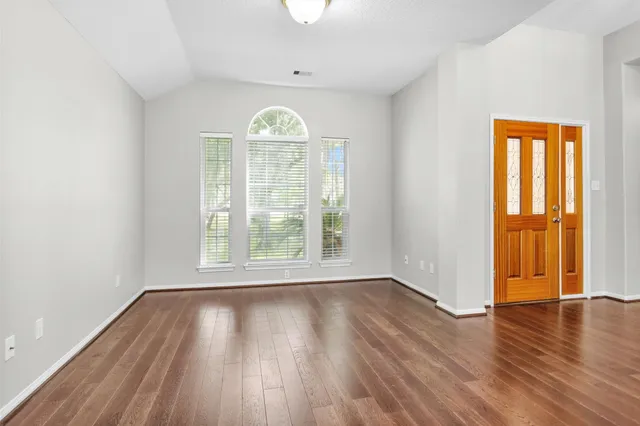 a view of an entryway with wooden floor