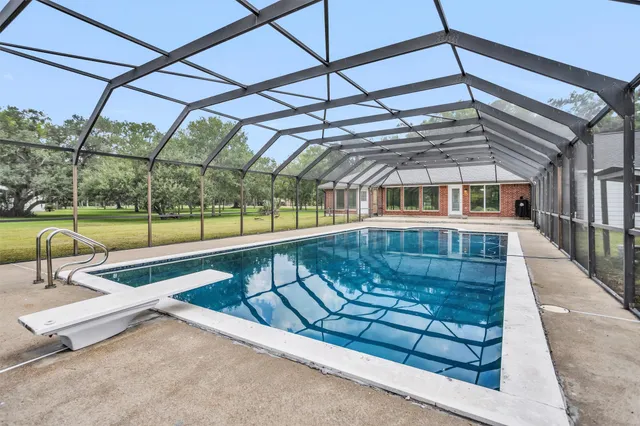 a view of a swimming pool with a patio