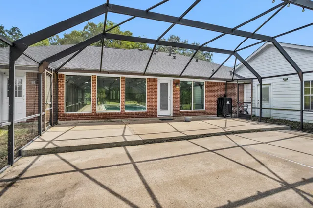 a view of a swimming pool with a yard