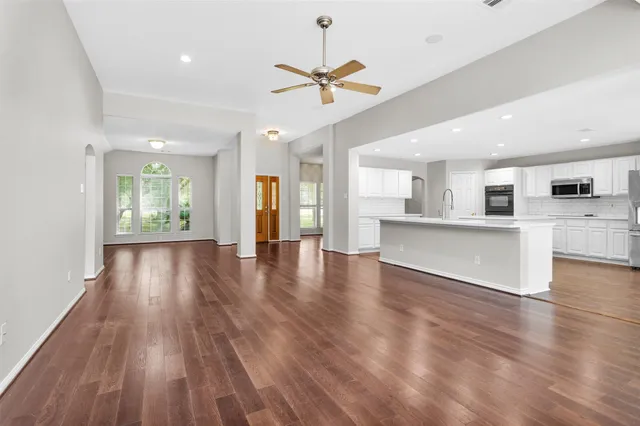 a huge green field with lots of trees