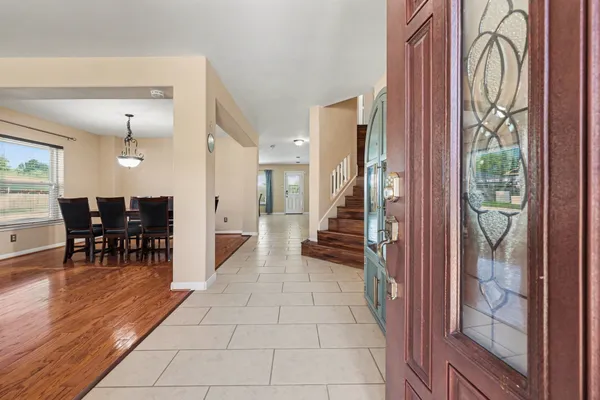 a kitchen with granite countertop stainless steel appliances and white cabinets