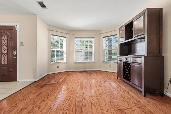 a kitchen with stainless steel appliances granite countertop a refrigerator stove microwave and sink