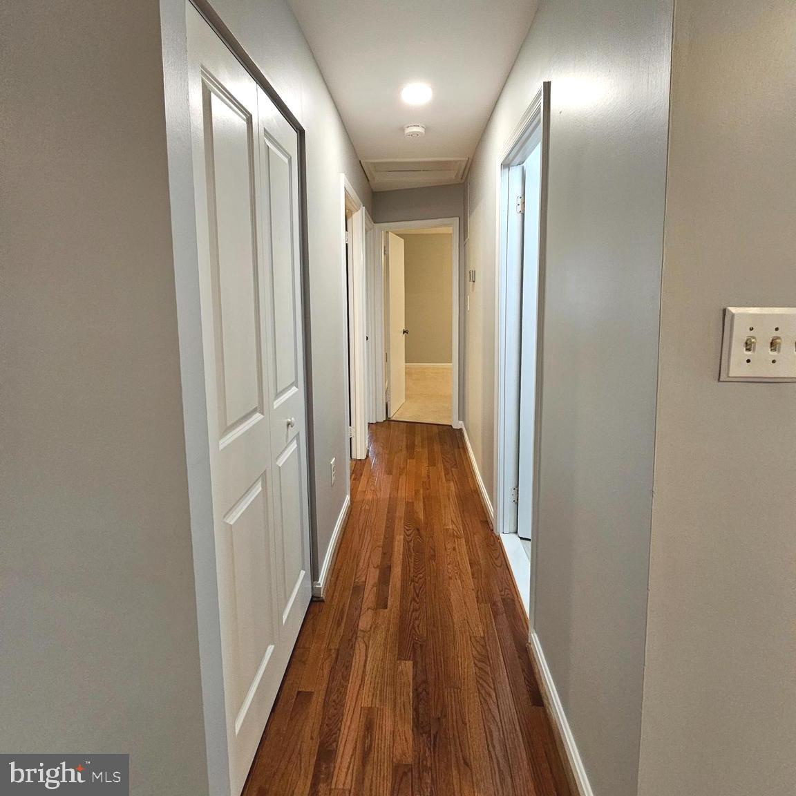 7777 Turlock Road Springfield, VA 22153 - Photo 12 of 43 a view of a hallway with wooden floor and staircase