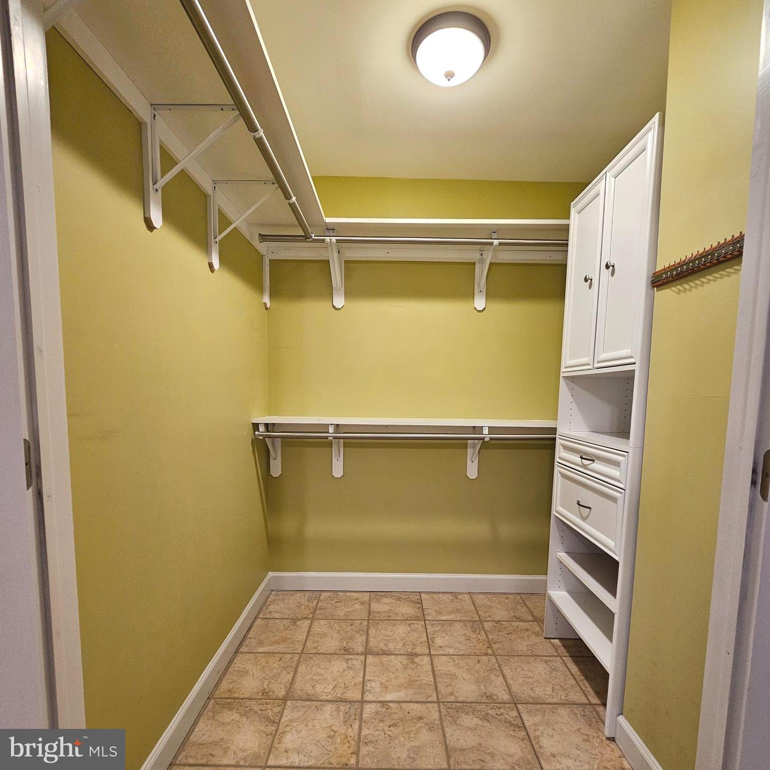 7777 Turlock Road Springfield, VA 22153 - Photo 16 of 43 a view of walk in closet with empty racks