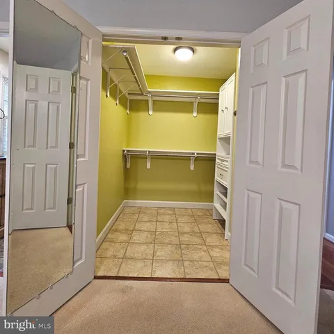 a bathroom with a tub shower and vanity