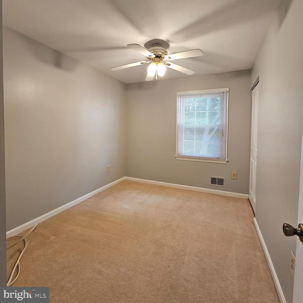 7777 Turlock Road Springfield, VA 22153 - Photo 19 of 43 a view of an empty room with a chandelier fan