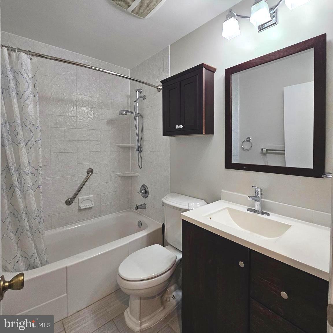 7777 Turlock Road Springfield, VA 22153 - Photo 22 of 43 a bathroom with a sink toilet and shower