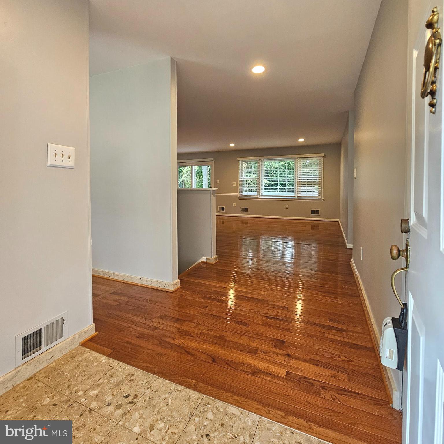 7777 Turlock Road Springfield, VA 22153 - Photo 3 of 43 a view of a hallway with wooden floor