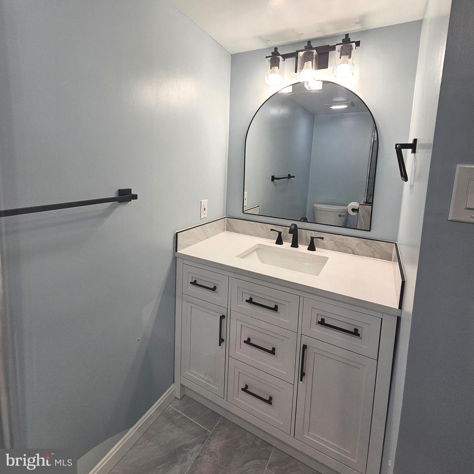 7777 Turlock Road Springfield, VA 22153 - Photo 33 of 43 a bathroom with a sink and a mirror