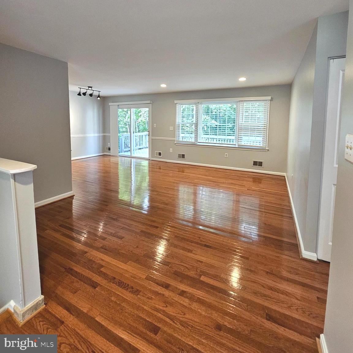 7777 Turlock Road Springfield, VA 22153 - Photo 4 of 43 a view of empty room with wooden floor and fan