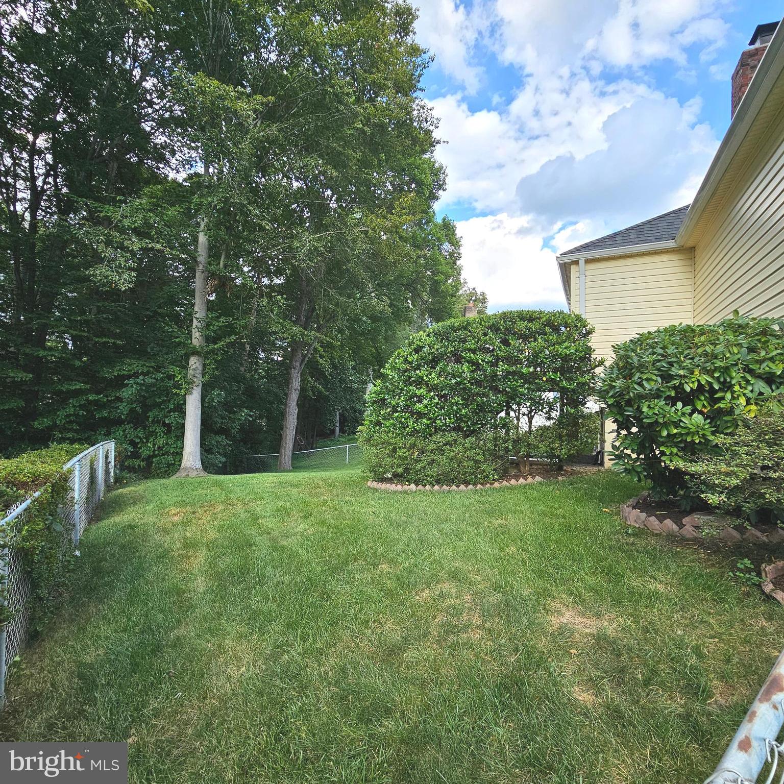 7777 Turlock Road Springfield, VA 22153 - Photo 42 of 43 a view of a house with a backyard
