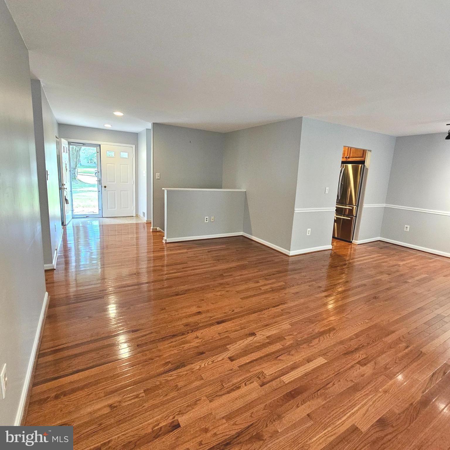7777 Turlock Road Springfield, VA 22153 - Photo 5 of 43 a view of empty room with wooden floor and fan
