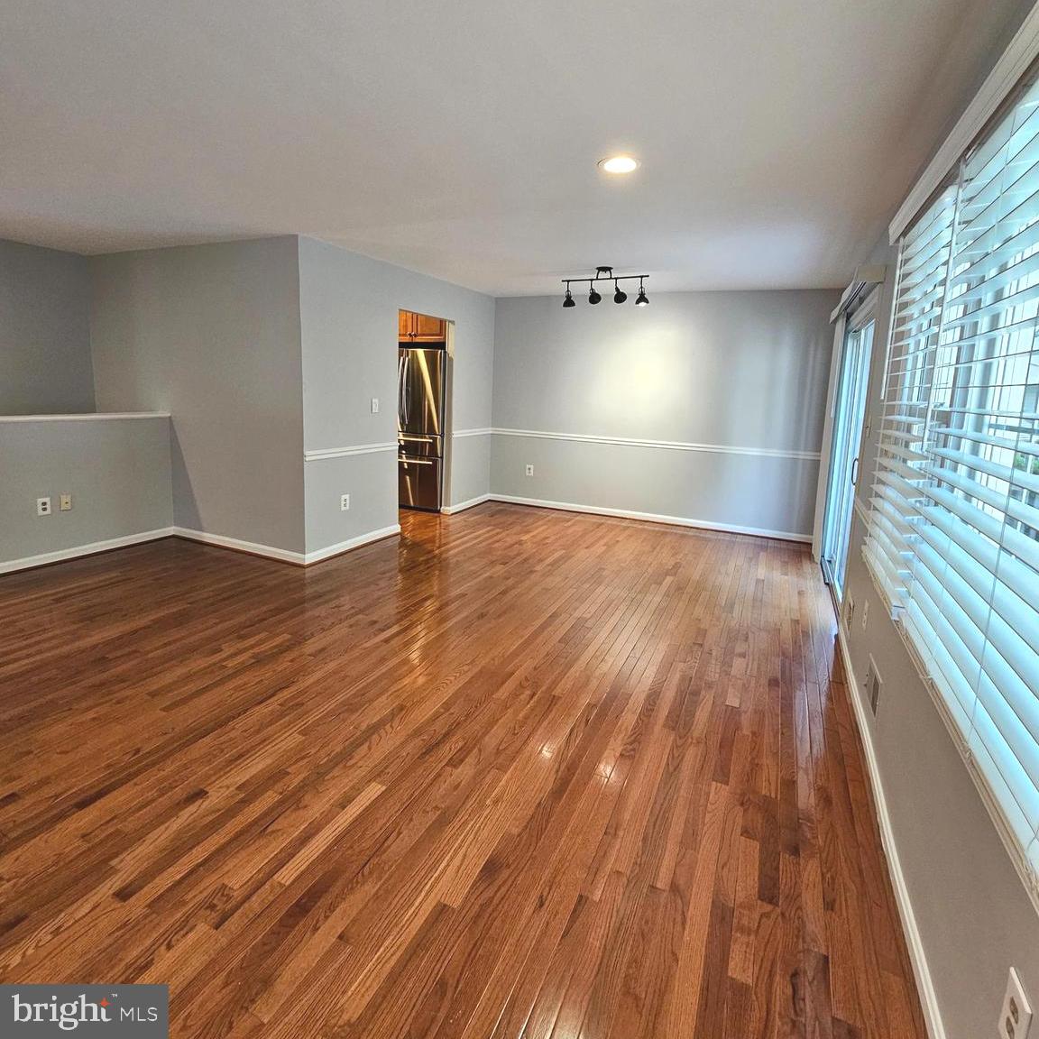 7777 Turlock Road Springfield, VA 22153 - Photo 6 of 43 a view of empty room with wooden floor and fan