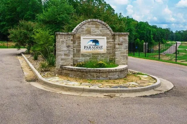 a view of a swimming pool with a yard
