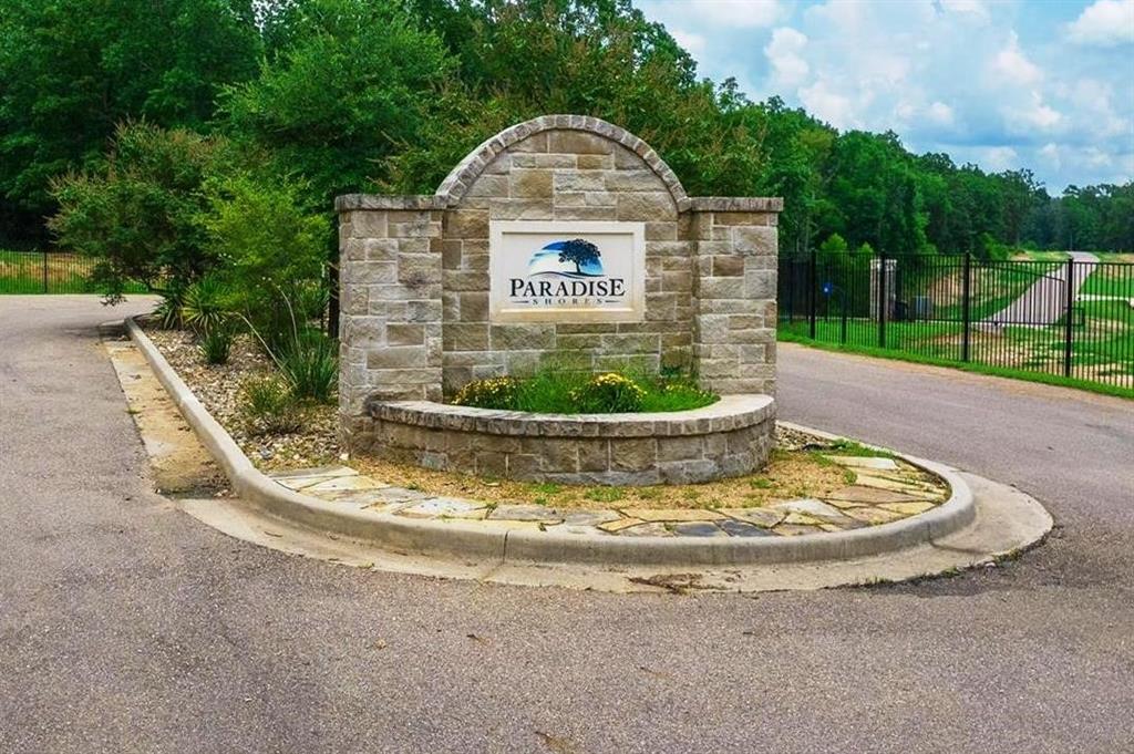 a view of a swimming pool with a yard