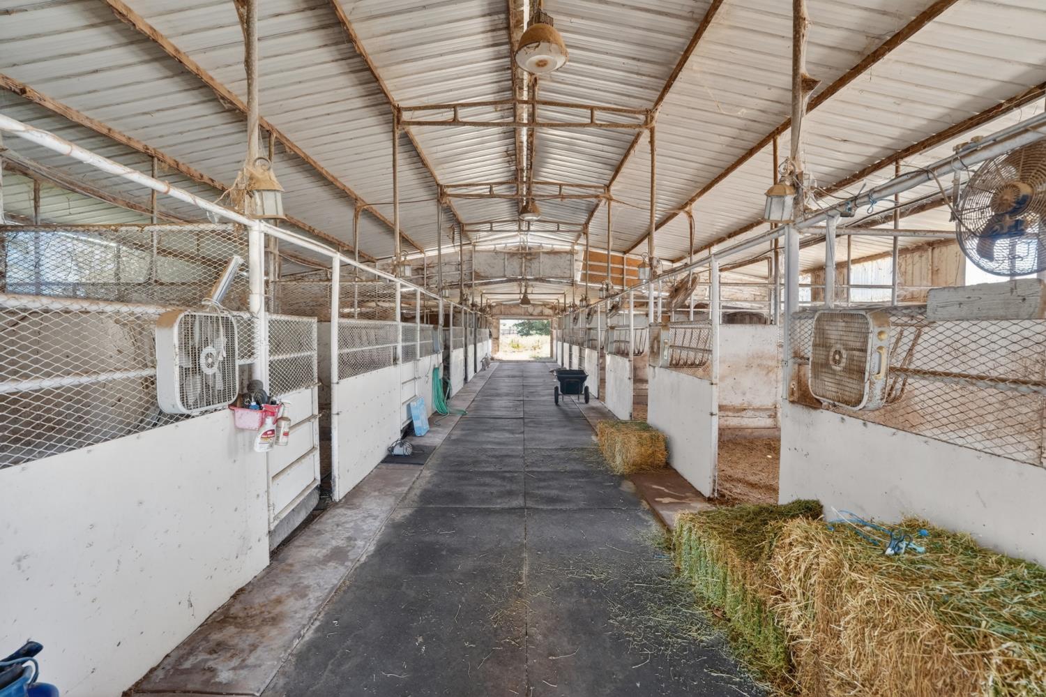 24390 North Jack Tone Road Acampo, CA 95220 - Photo 7 of 40 Breeding Barn. 16- 12x24 stalls, vet room, breeding stock, tack room, misting system with auto water and lights.