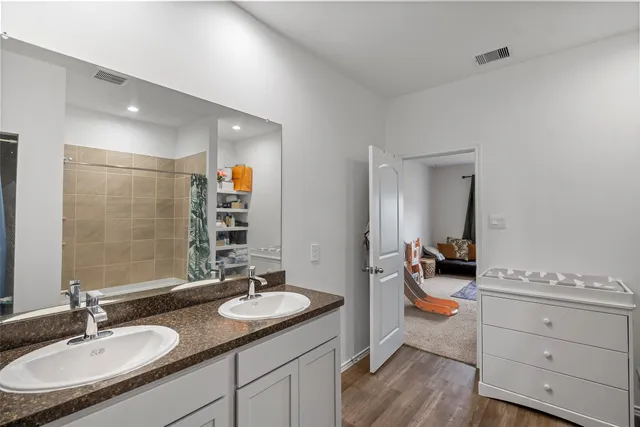 a bathroom with a bathtub and a shelf