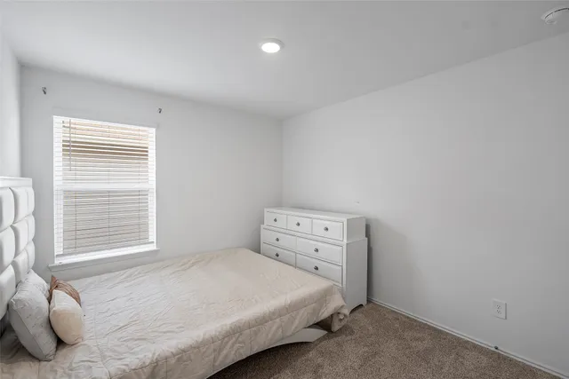 a en suite bathroom with double sink and a mirror