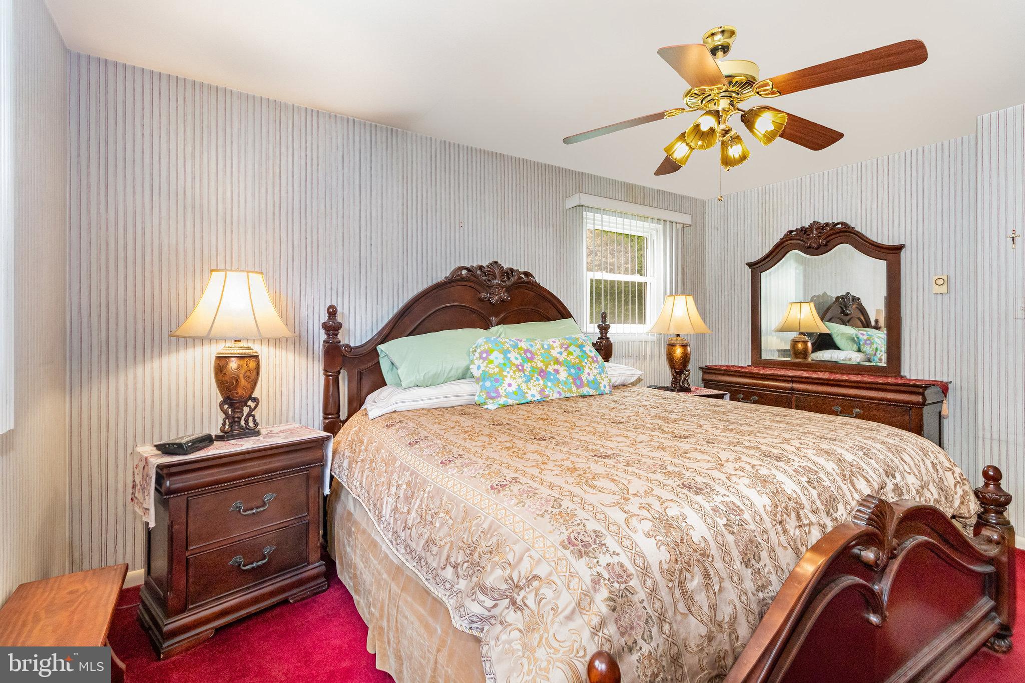 414 Trudy Road Harrisburg, PA 17109 - Photo 13 of 26 a bedroom with a bed and a chandelier