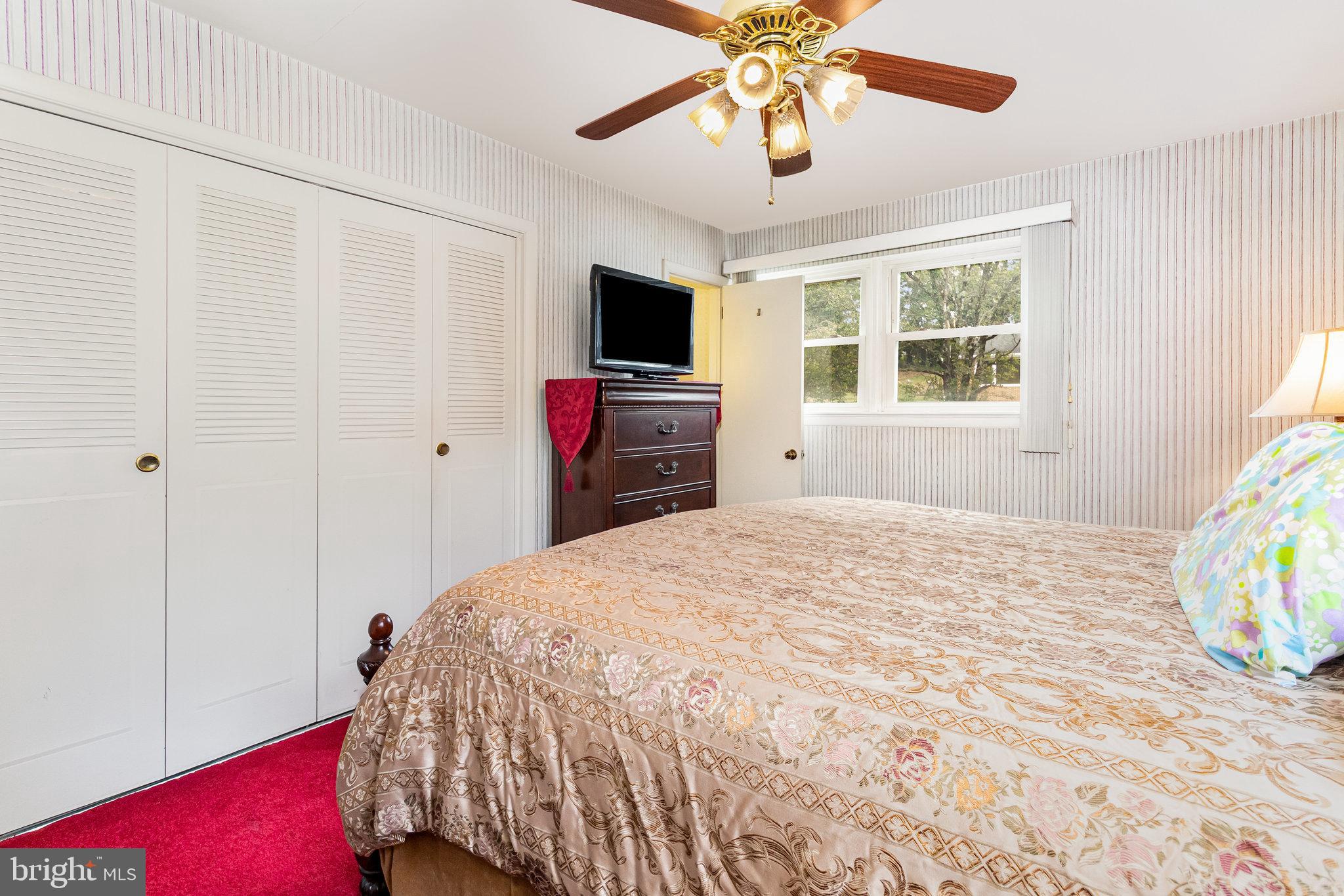 414 Trudy Road Harrisburg, PA 17109 - Photo 14 of 26 a bedroom with a bed and a flat screen tv