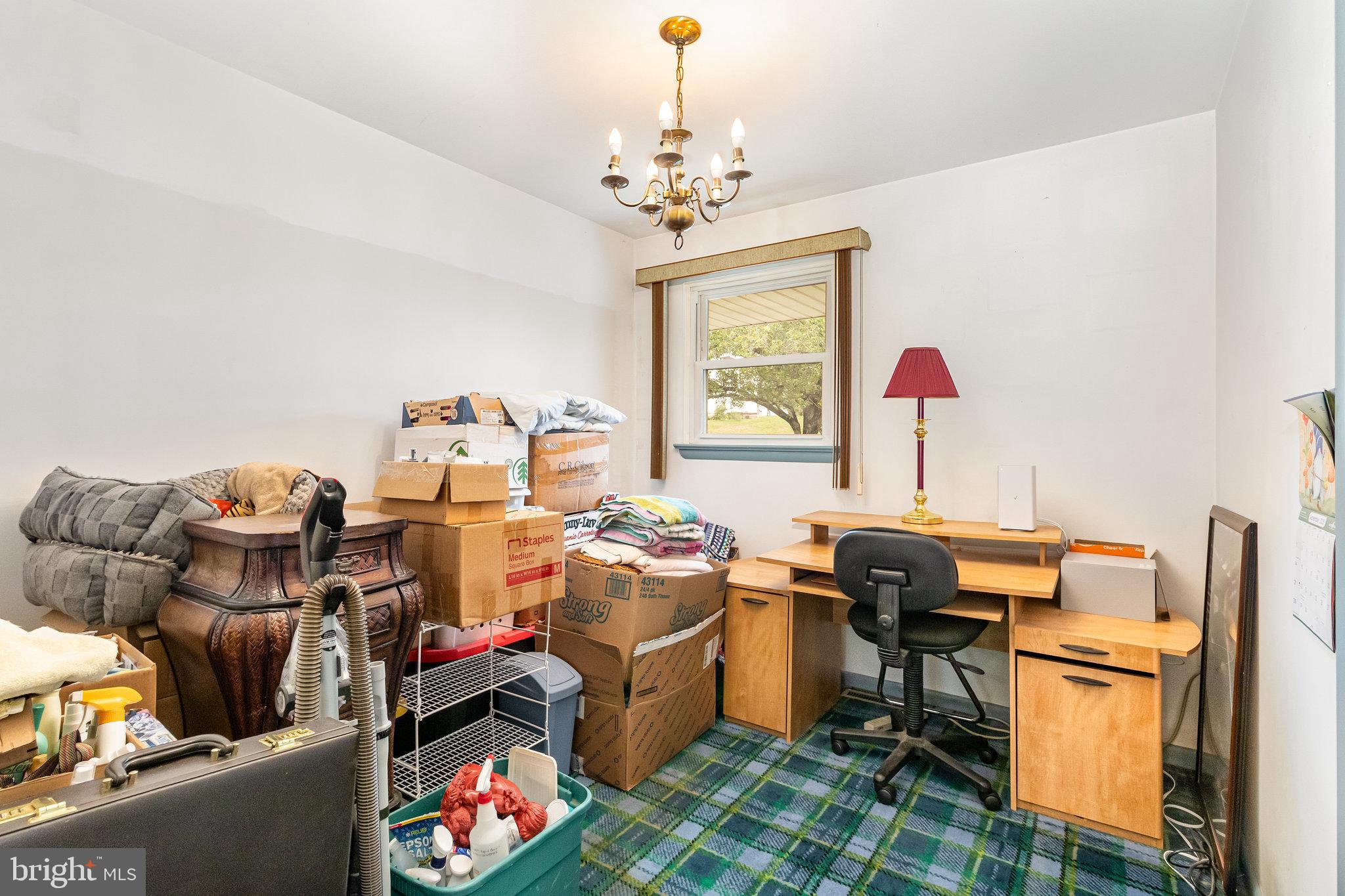 414 Trudy Road Harrisburg, PA 17109 - Photo 16 of 26 a room with furniture a chandelier and a window