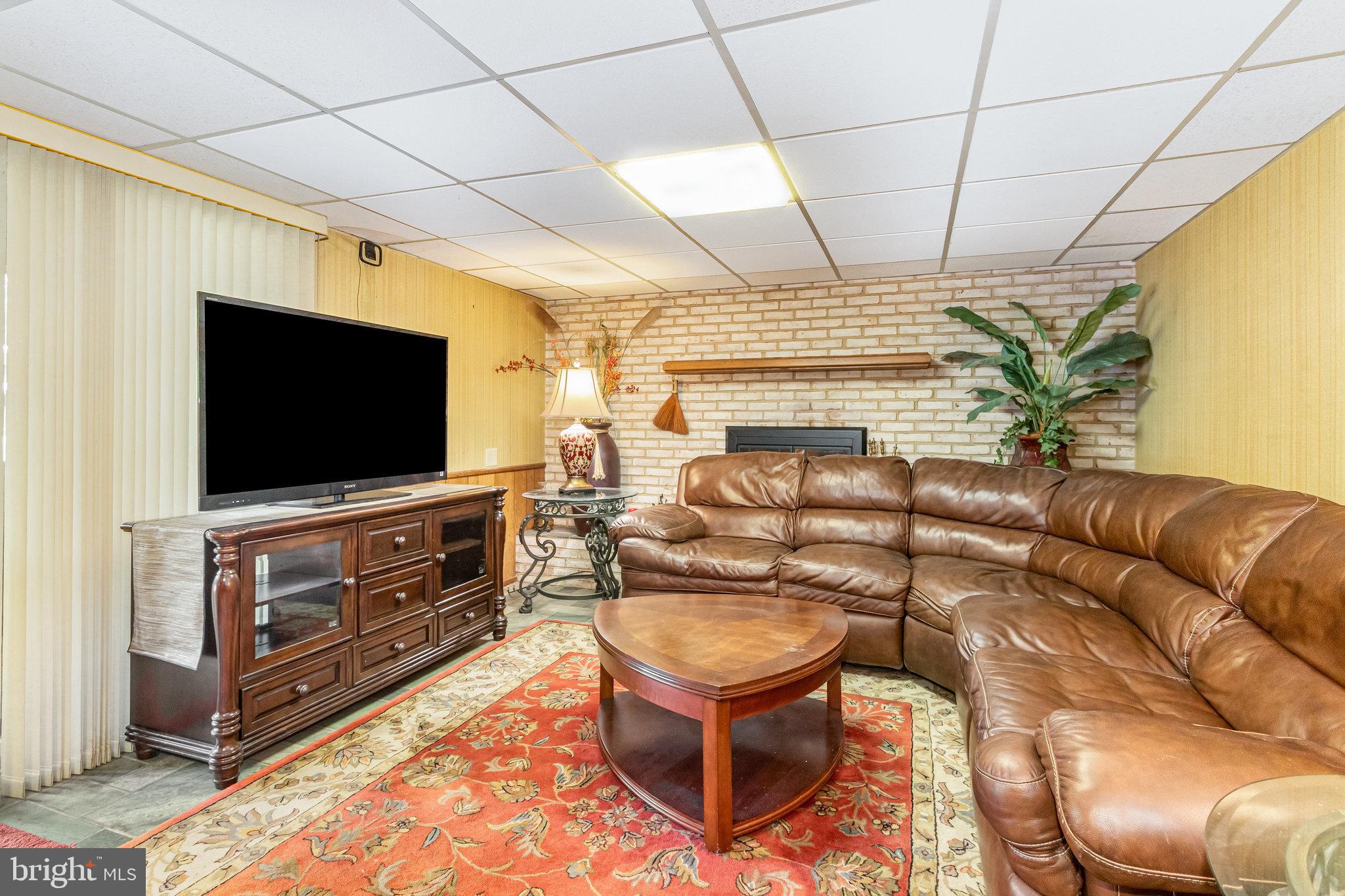 414 Trudy Road Harrisburg, PA 17109 - Photo 20 of 26 a living room with furniture and a flat screen tv