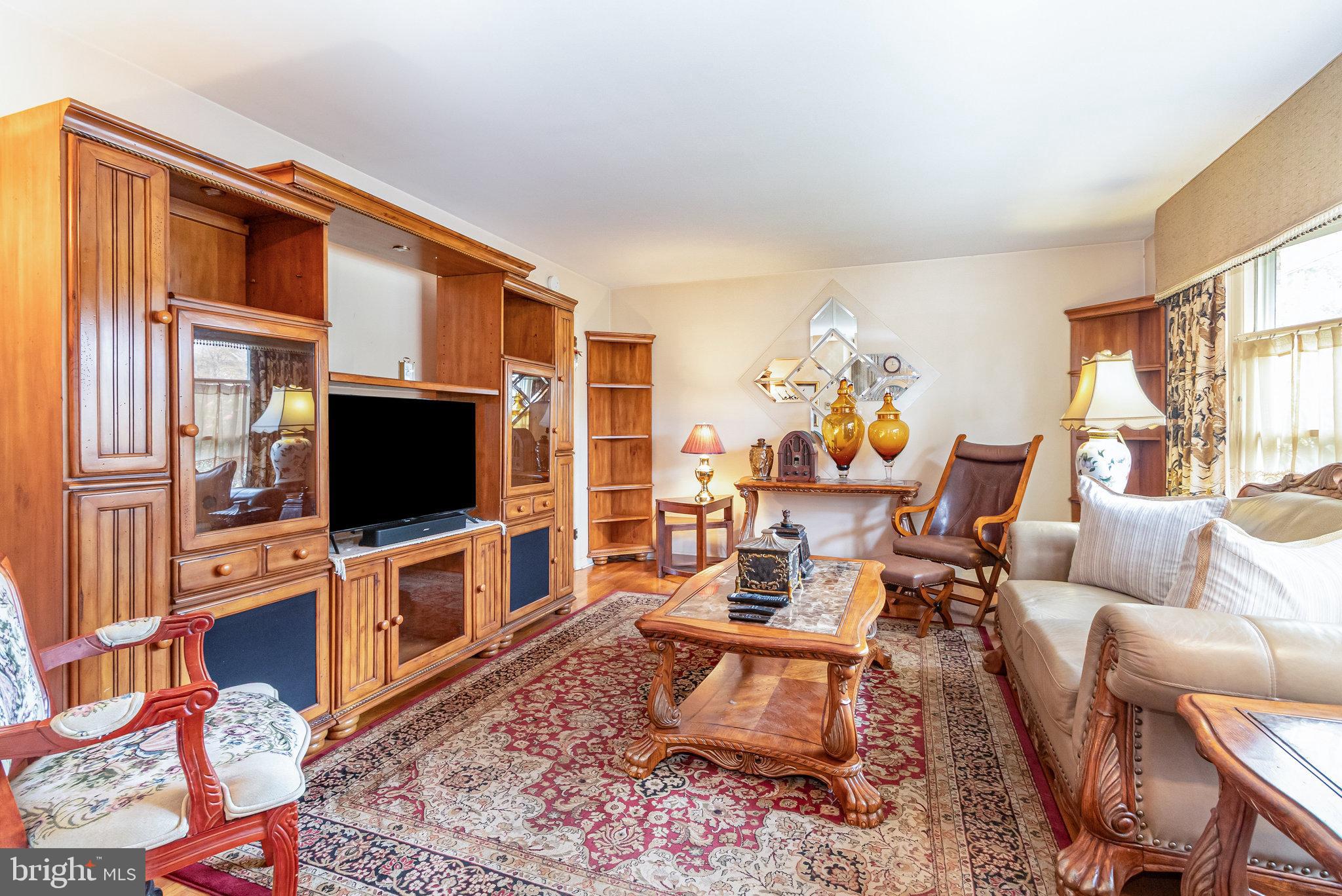 414 Trudy Road Harrisburg, PA 17109 - Photo 4 of 26 a living room with furniture and a flat screen tv