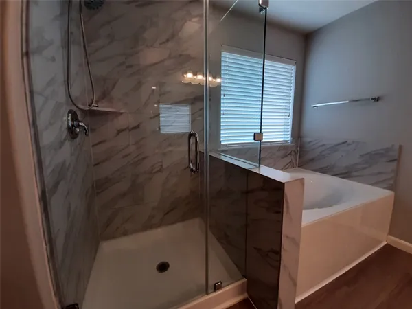 a bathroom with a sink and shower