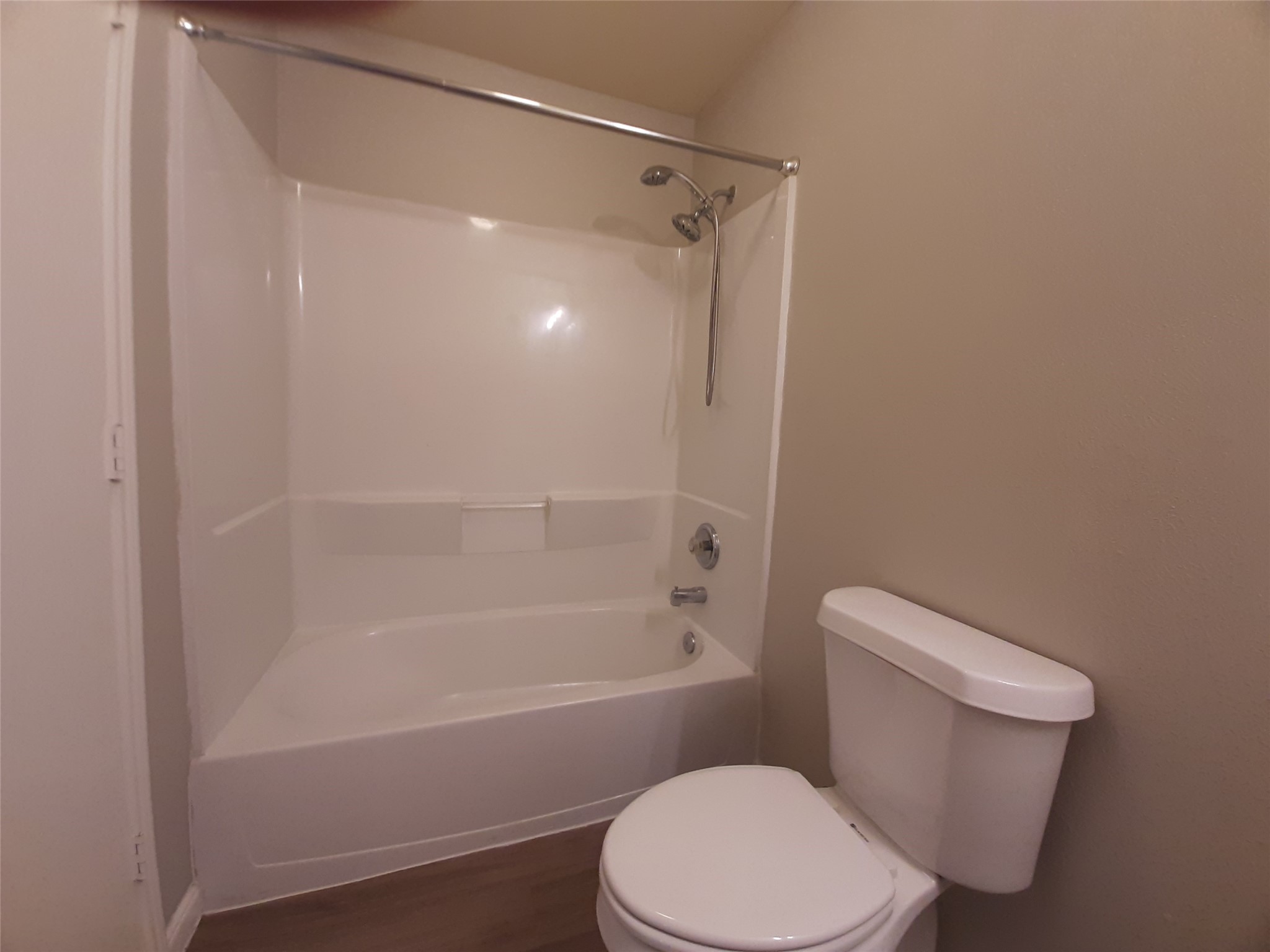 20526 Rustic Rail Court Cypress, TX 77433 - Photo 20 of 23 a white toilet and tub sitting next to a bathroom sink