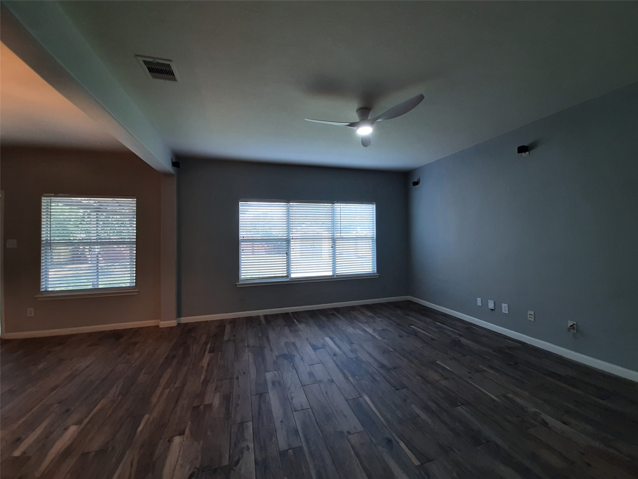 20526 Rustic Rail Court Cypress, TX 77433 - Photo 3 of 23 an empty room with wooden floor and windows