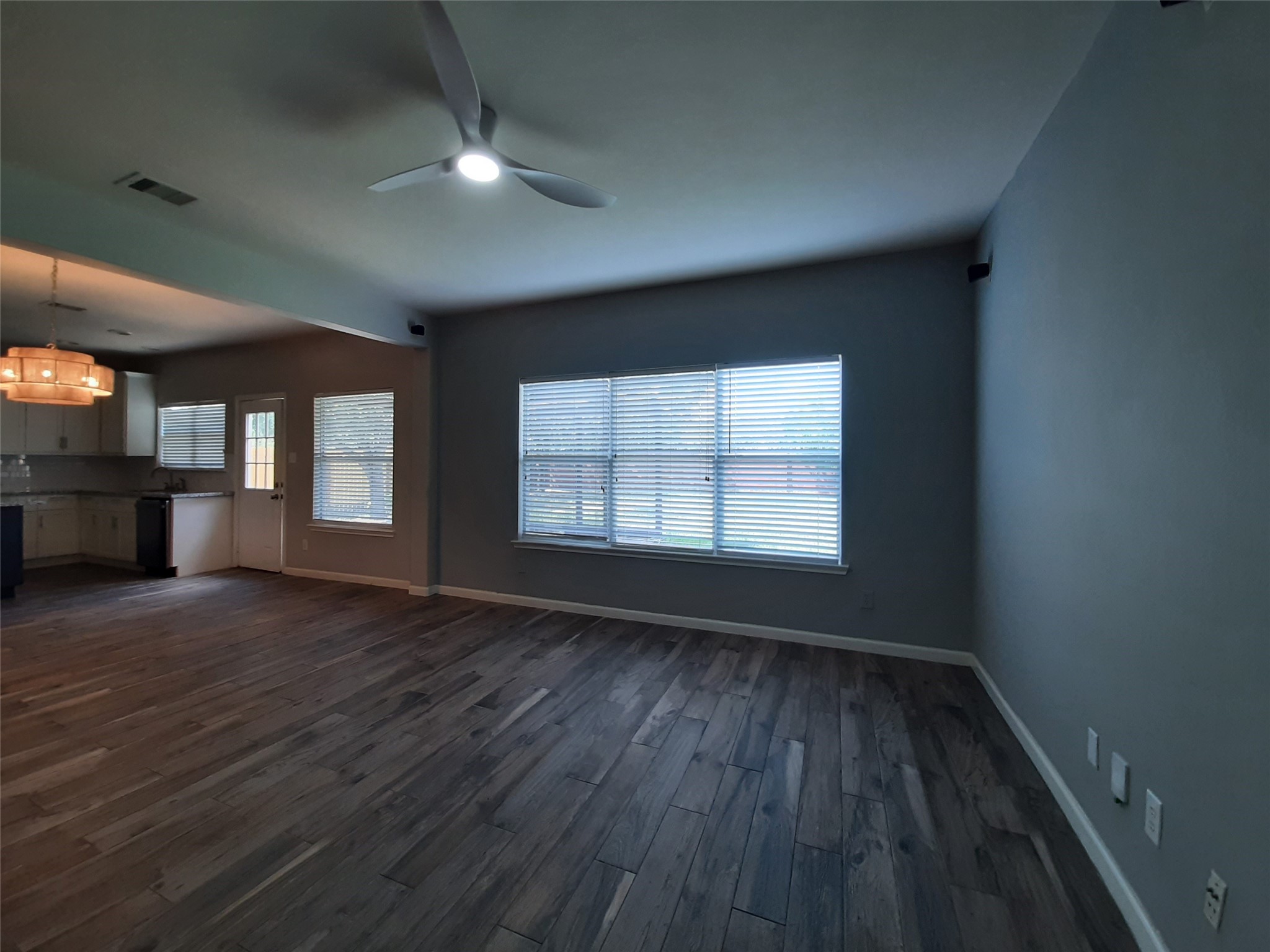 20526 Rustic Rail Court Cypress, TX 77433 - Photo 6 of 23 an empty room with wooden floor and windows