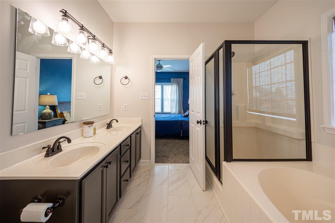 4425 Gallatree Lane Raleigh, NC 27616 - Photo 15 of 24 Updated master bath. New tile flooring and fixtures.