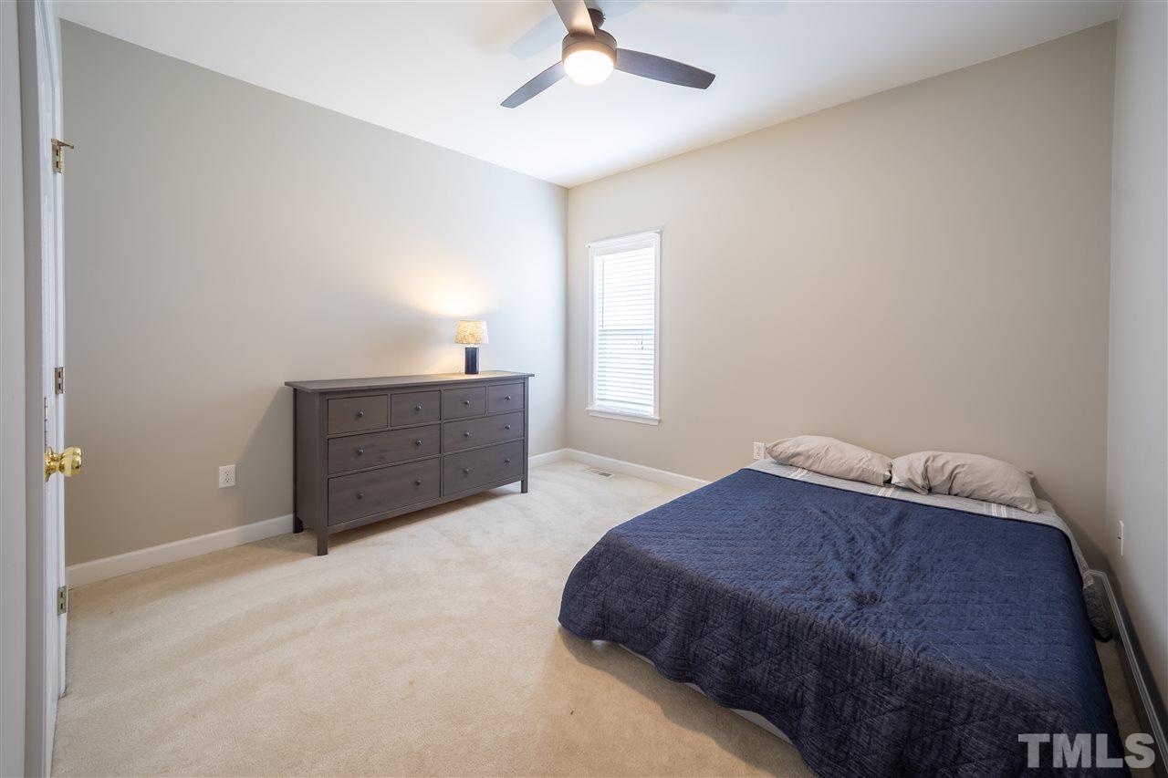 4425 Gallatree Lane Raleigh, NC 27616 - Photo 18 of 24 Large bedroom. Fresh paint and updated light fixture/fan.