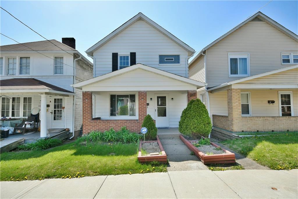 335 Mercer Street Turtle Creek, PA 15145 - Photo 1 of 25 a front view of a house with a yard