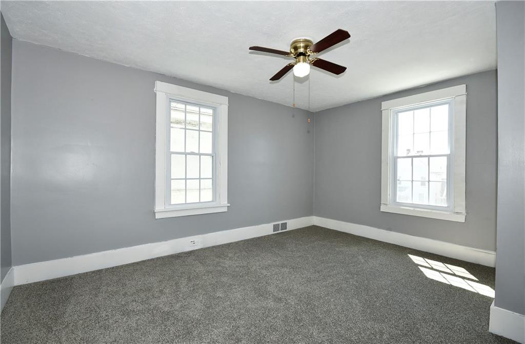 335 Mercer Street Turtle Creek, PA 15145 - Photo 15 of 25 an empty room with a window